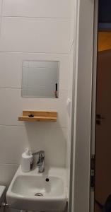 a bathroom with a sink and a mirror at Jugata in Rudna Wielka
