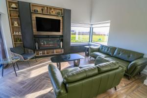 a living room with a couch and a fireplace at An Tobar in Ballina