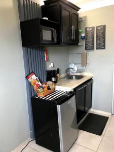 a kitchen with a sink and a stove top oven at Independent, central studio Apt3-A in El Seis