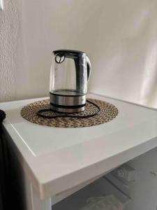 a coffee pot sitting on a table at Apartmán U Štýbnarů in Bulhary