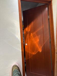a person standing in front of a wooden door at Víctorhaus in San Gregorio Cuautzingo