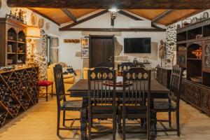 a dining room with a table and chairs at Refúgio da Cancela - Arouca Stay in Arouca