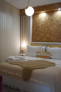 a bedroom with a large bed with white pillows at Casa das Caldas in Caldelas +79 photos