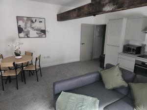 a living room with a couch and a table at C&B Holdings in Hull