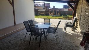 a table and chairs sitting on a patio at Casa Stefu in Râşnov