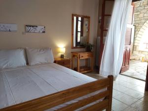 a bedroom with a large bed in a room at Almyra apt in Mani in Kotrónion