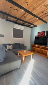 a living room with a couch and a table at Hotel Luz de Luna y Villas in San Jerónimo
