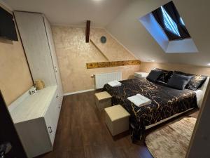 a small bedroom with a bed and a bathroom at TOMISLAV in Zagreb
