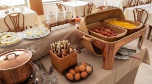a table with some food and eggs on it at Igea Spiaggia Home Holiday in Bellaria-Igea Marina