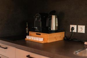 a coffeemaker sitting on top of a kitchen counter at Tiny boat house #2 in Garnwerd