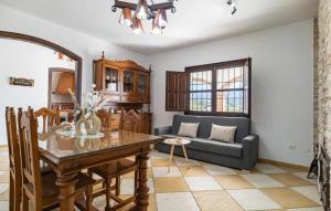 a living room with a table and a couch at Villa La Colina in Torrox