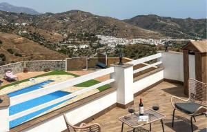 a villa with a swimming pool on a hill at Villa La Colina in Torrox