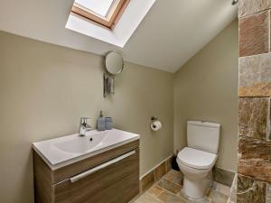 a bathroom with a toilet and a sink and a skylight at 2 Bed in Middlesbrough oc-75226 in Great Ayton +15 photos