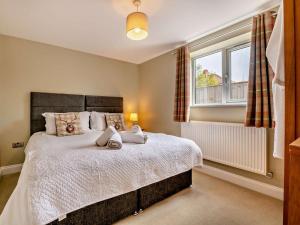 a bedroom with a large bed and a window at 2 Bed in Middlesbrough oc-75226 in Great Ayton