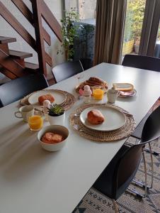 a white table with breakfast foods on it at vakantieverblijf Coo-sy in Stavelot