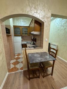 a kitchen with a table and chairs in a room at TOMISLAV in Zagreb +77 photos