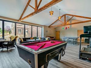 a living room with a pool table in it at 5 Bed in Leeds oc-91355 in Sherburn in Elmet