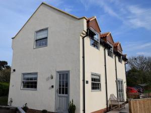 a white house with windows and a roof at 2 Bed in Stokesley oc-g0072 in Carlton