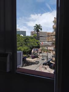 a view of a city street from a window at Estalagem Triplex Vermelho in Vitória