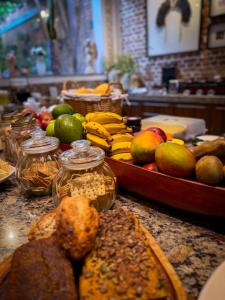 a bunch of fruits and vegetables on a counter at Virgínia Palace in Corumbá