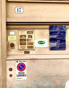 an atm machine with signs on the side of it at Hotel Duca D'Aosta in Florence +44 photos