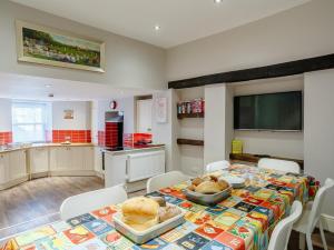 a kitchen with a table with food on it at 4 Bed in Harrogate oc-hh025 in Harrogate