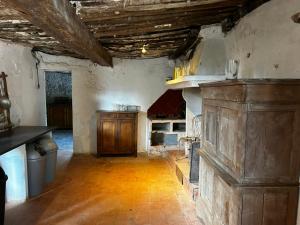 a large room with a fireplace in a building at Maison Nomade Provence - MaisonNomadeChic in Coursegoules +29 photos