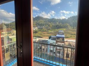 a view from a window of a building at Son Tinh Hotel in Dồng Văn