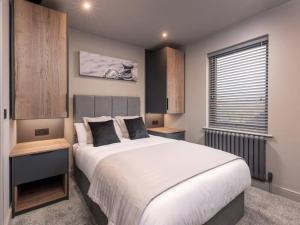 a bedroom with a large bed and a window at 4 Bed in Morpeth oc-93775 in Thropton +26 photos