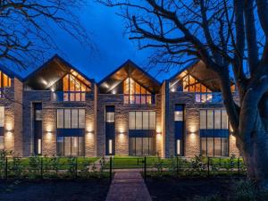 an exterior view of a building at night at 4 Bed in Morpeth oc-93775 in Thropton