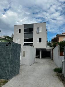 a large white building with a lot of windows at Apartlaguna Prime in Laguna