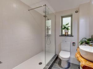 a bathroom with a shower and a toilet and a sink at 3 Bed in Otley oc-g0176 in Timble +24 photos