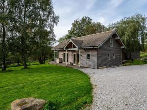 a small house with a gravel driveway at 3 Bed in Otley oc-g0176 in Timble