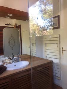 a bathroom with a sink and a mirror at Woodune in Neufchâtel-Hardelot +8 photos