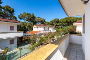 a view from the balcony of a house with a swimming pool at Gelso Selvatico by BarbarHouse in Specchiolla
