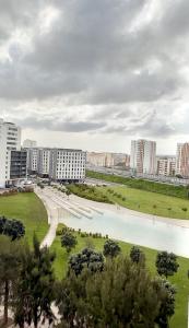 a view of a city with a river and buildings at Suíte aconchegante in Lisbon