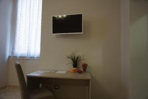 TV a/nebo společenská místnost v ubytování Residence Stendhal Guest House