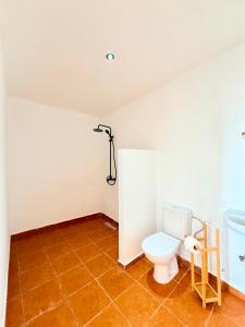 a bathroom with a toilet and a sink at Hakuna Matata Guest House in Tamraght Ouzdar