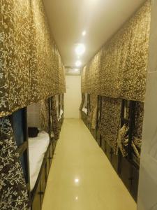 a room with a row of bunk beds at Farhan DORMITORY in Mumbai