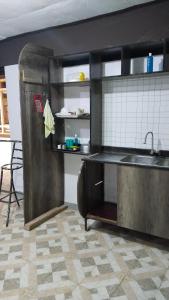 a kitchen with a sink and a counter top at royal care villas in Thika