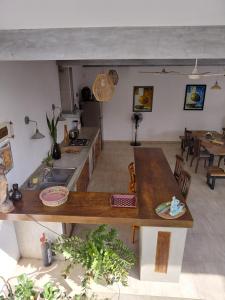 a kitchen with a counter top and a table at Villa Mosaic in Tangalle