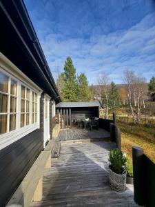 a porch of a house with a patio at Bjorlicabin in Bjorli
