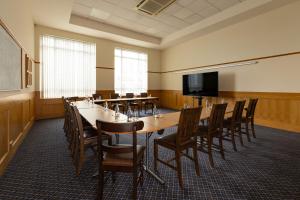 a conference room with a long table and chairs at Portrush Atlantic Hotel in Portrush