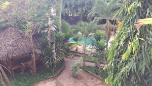 a resort with a swimming pool and palm trees at Diani Haven Swahili modern studio in Kwale