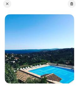 an aerial view of a swimming pool with chairs at Côte d azur Magnifique studio in Les Issambres
