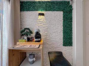 a room with a table and a brick wall at 49 Sea Rooms - Guesthouse by Host Hero in Stintino +87 photos