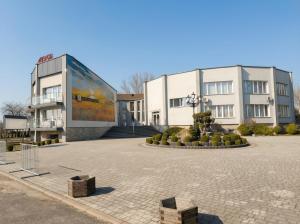 a building with a large billboard in front of it at Złoty Łan in Nowa Sól