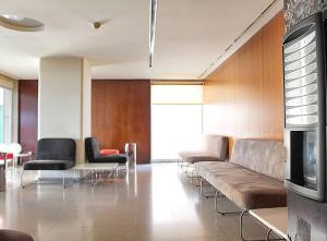 a living room with a couch and chairs and a table at Arrábida Luxury Studio in Vila Nova de Gaia