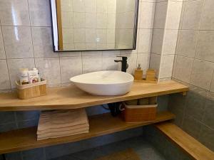 a bathroom counter with a sink and a mirror at Apartmani Perić in Stari Grad +37 photos
