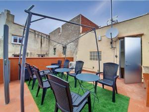a group of tables and chairs on a patio at Brise Douce in Perpignan